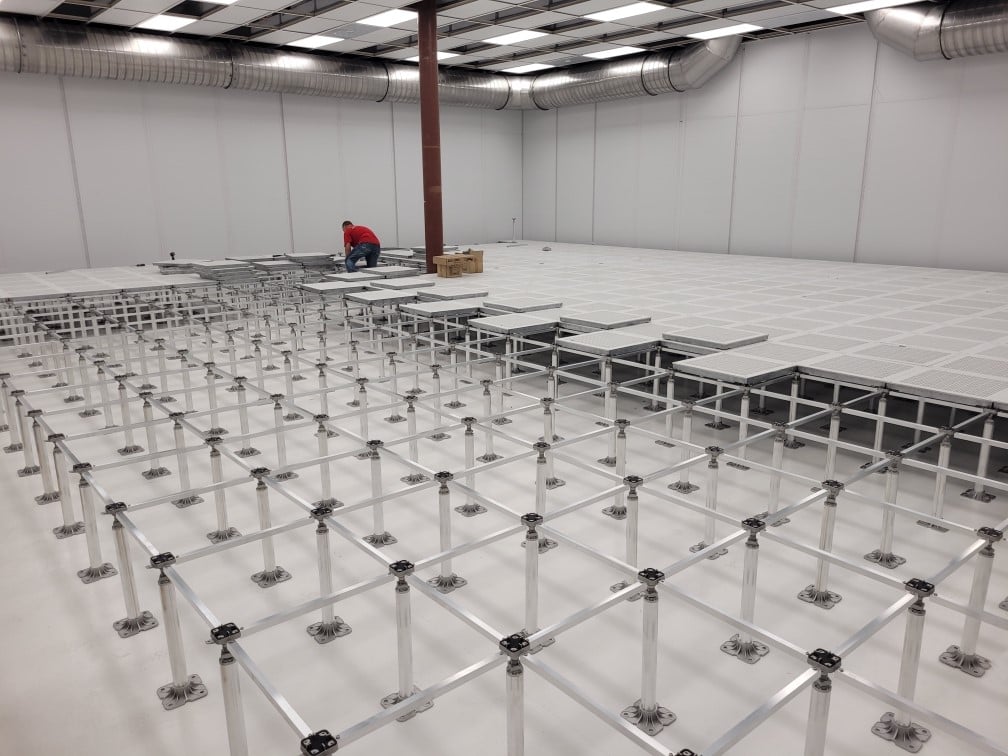 Installing a raised floor in a  semiconductor cleanroom.