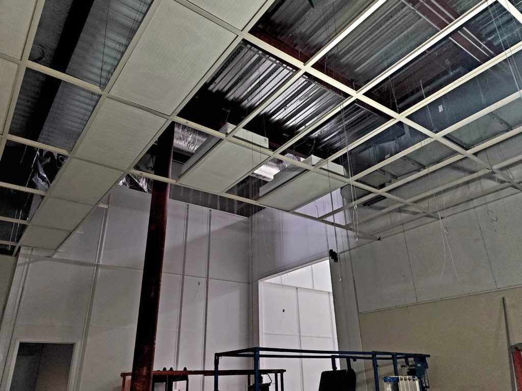 T-grid ceiling installation in a semiconductor cleanroom.